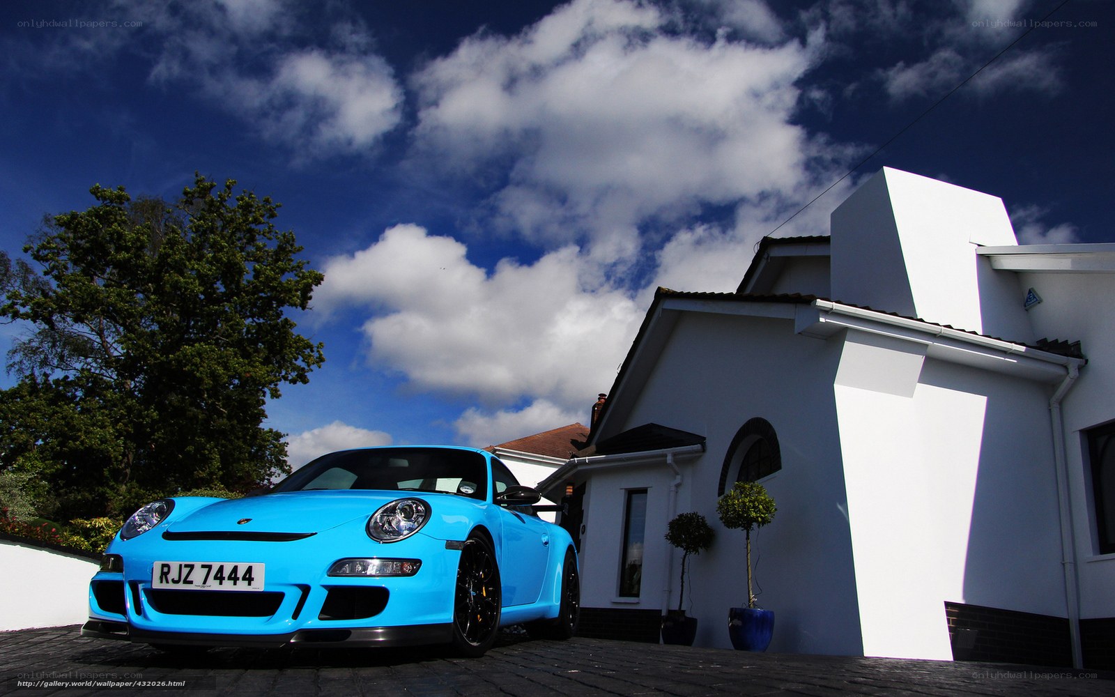 Blue Porsche in driveway