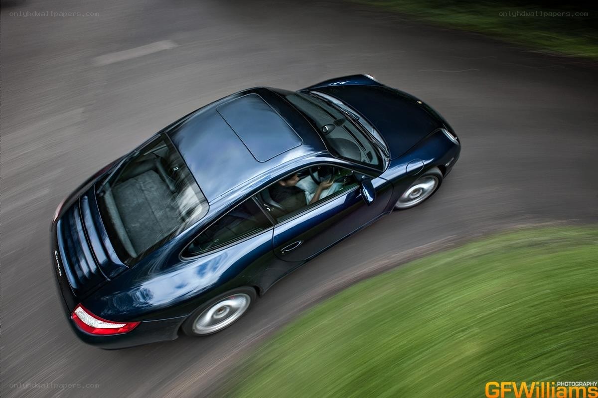 blue porsche in motion