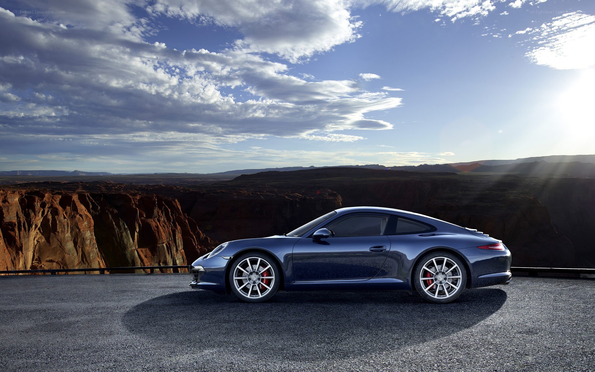Blue Porsche on a cliff
