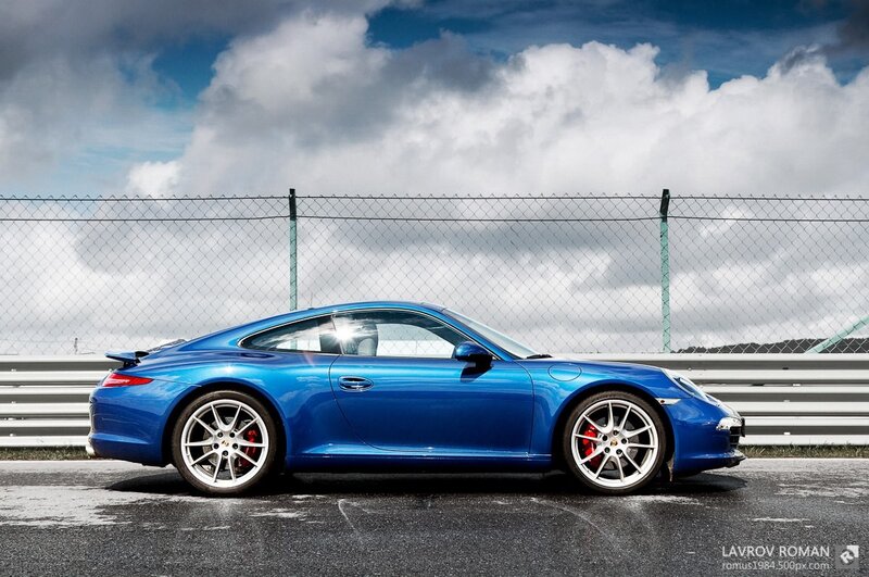 Blue Porsche on a racetrack