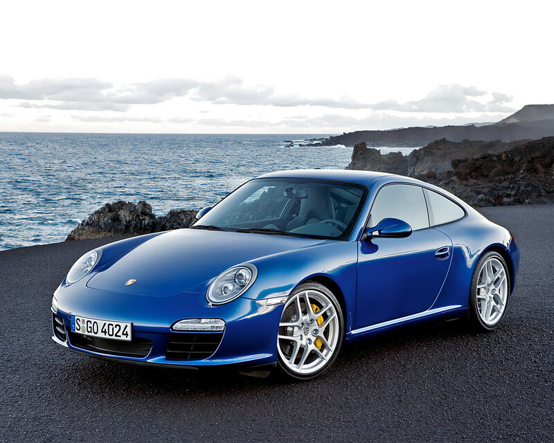 Blue Porsche on coastal road