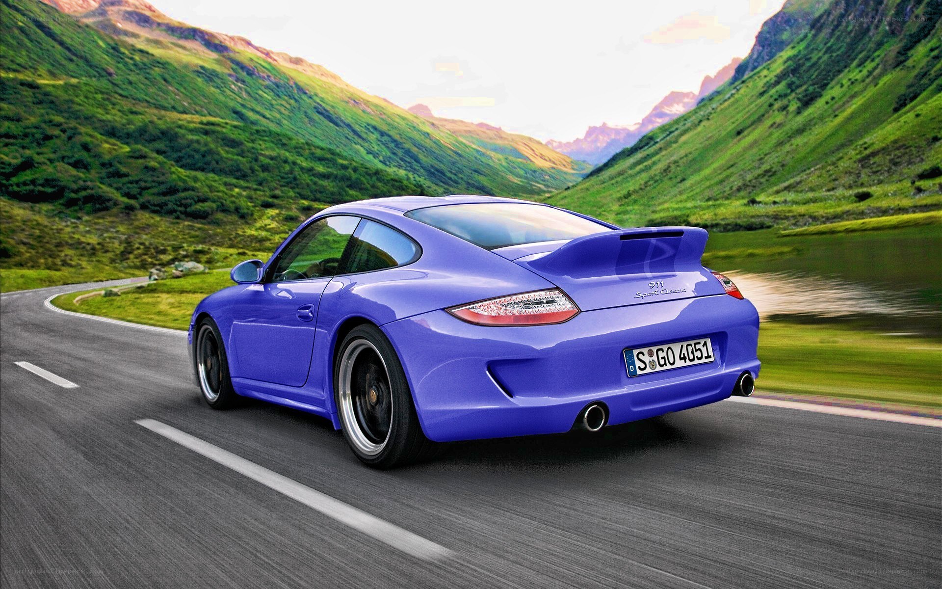 Blue Porsche on mountain road