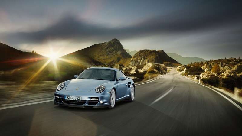 Blue Porsche on Mountain Road — Dramatic