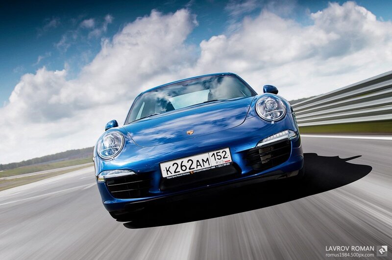 Blue Porsche on Racetrack — Dynamic