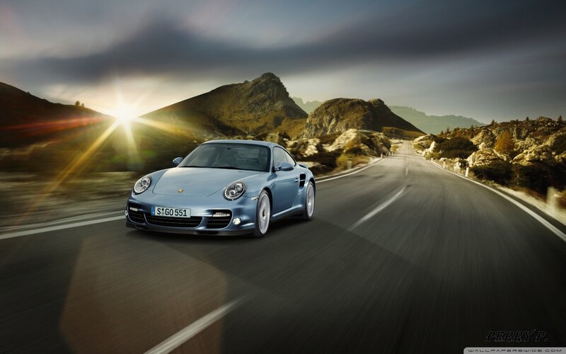 Blue Porsche on Road — Dramatic