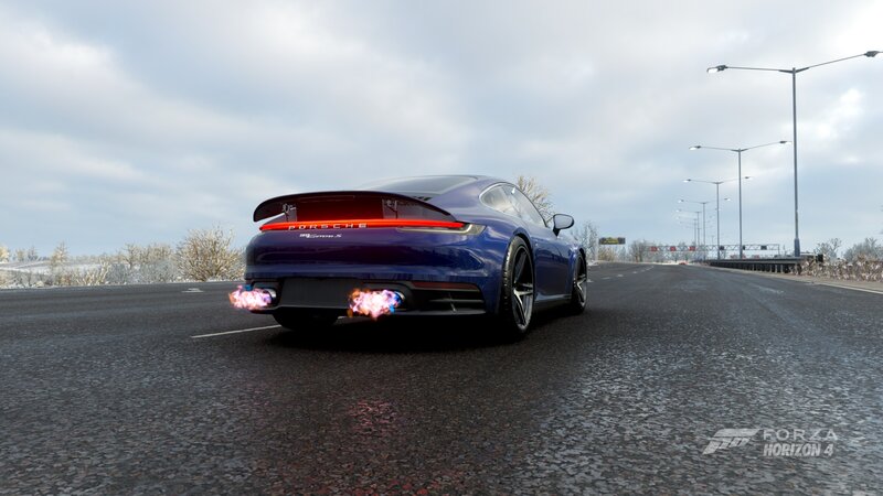 Blue Porsche on Road — Dynamic