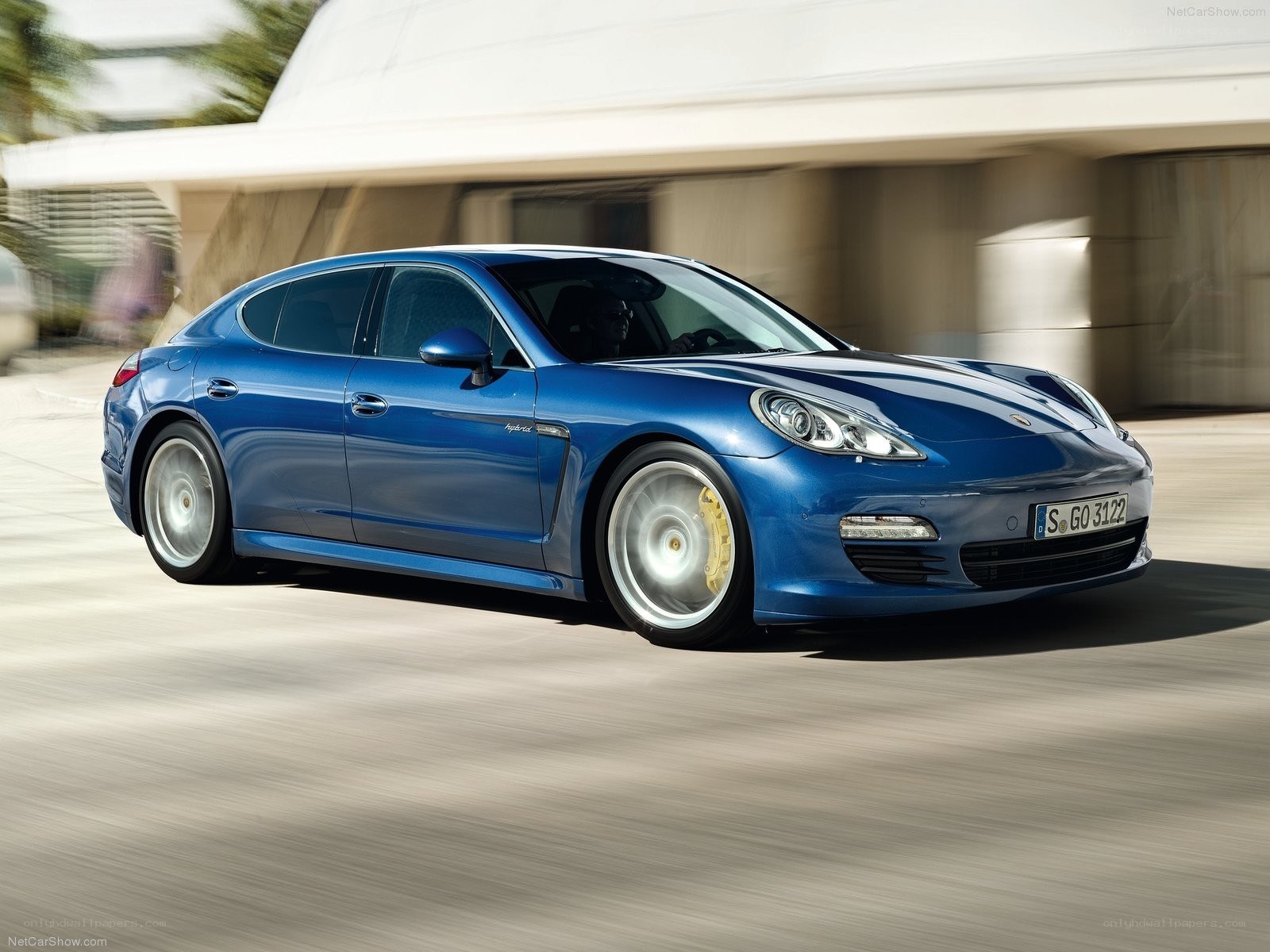 Blue Porsche Panamera in motion