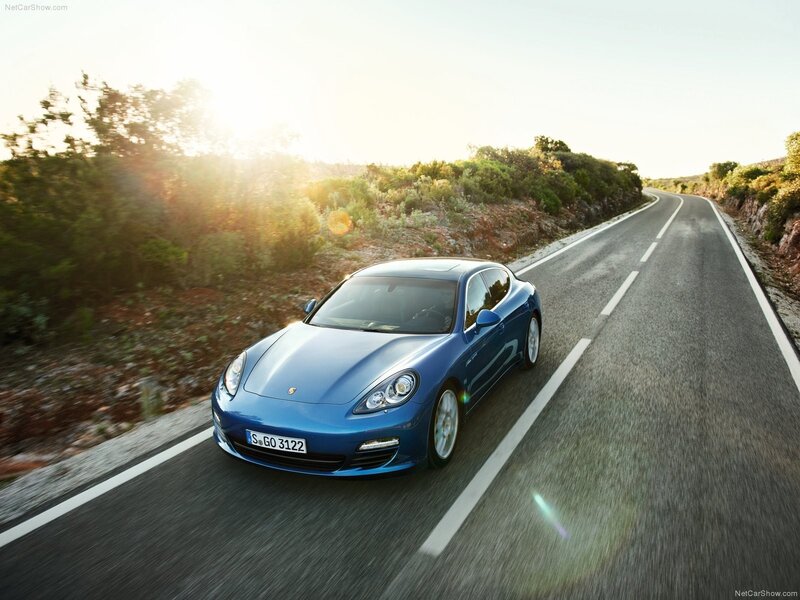 Blue Porsche Panamera on a winding road