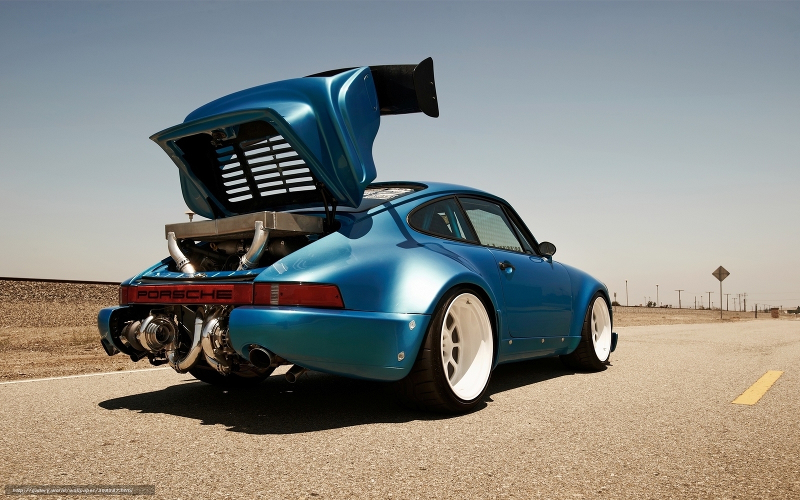 blue porsche with open engine bay