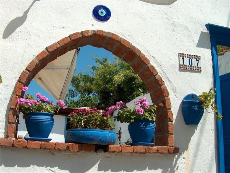 Blue pots under arched window