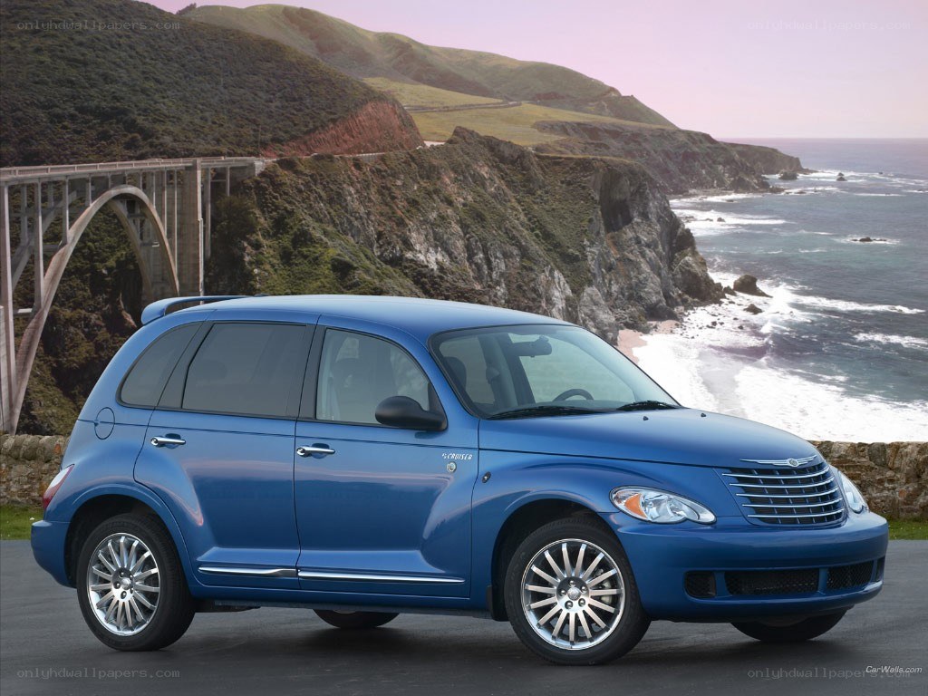 Blue PT Cruiser by the coast