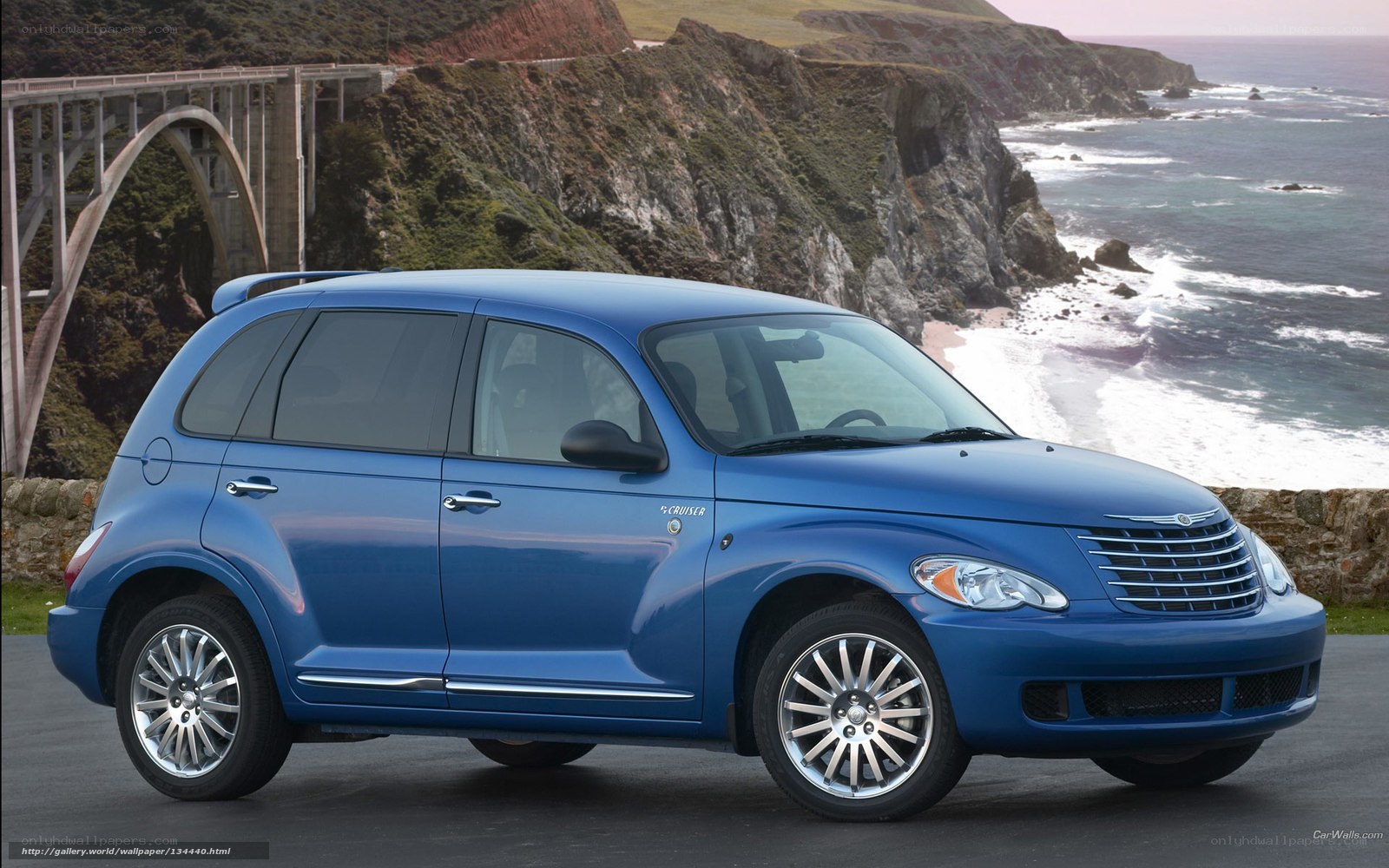 Blue PT Cruiser by the coast