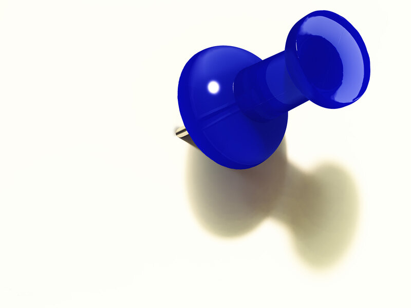 blue push pin on white
