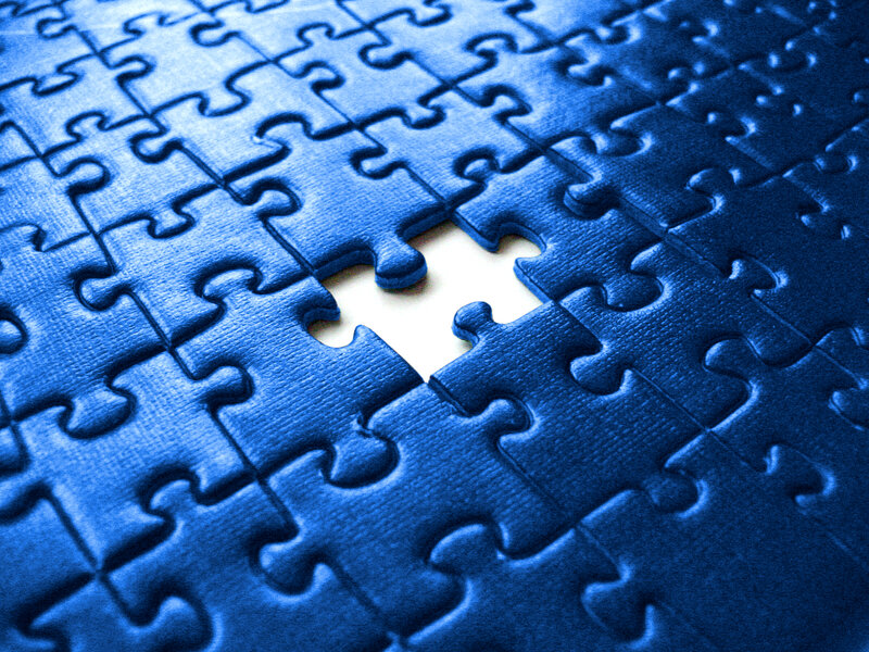 Blue puzzle with missing piece