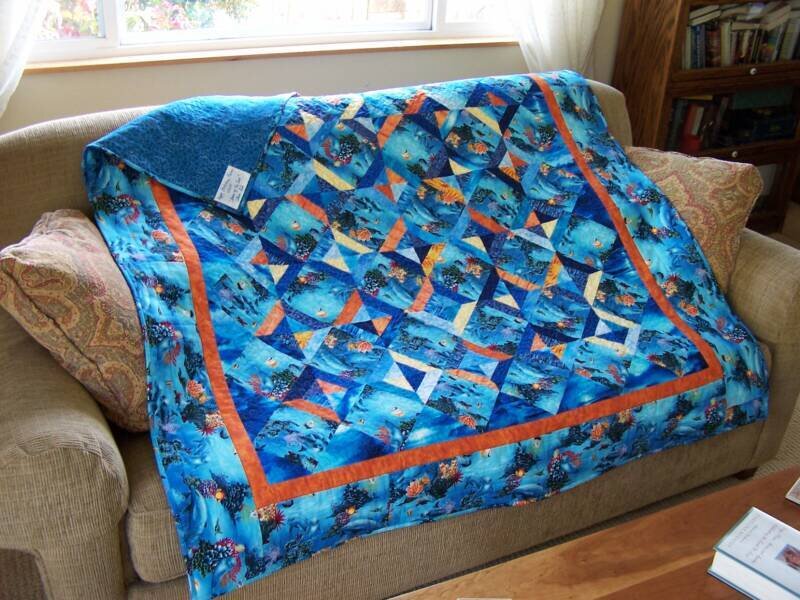 Blue quilt on a couch