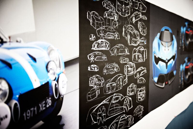 Blue race car and design sketches