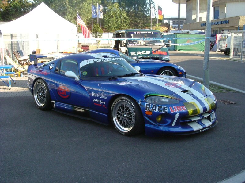 Blue race car at a motorsport event