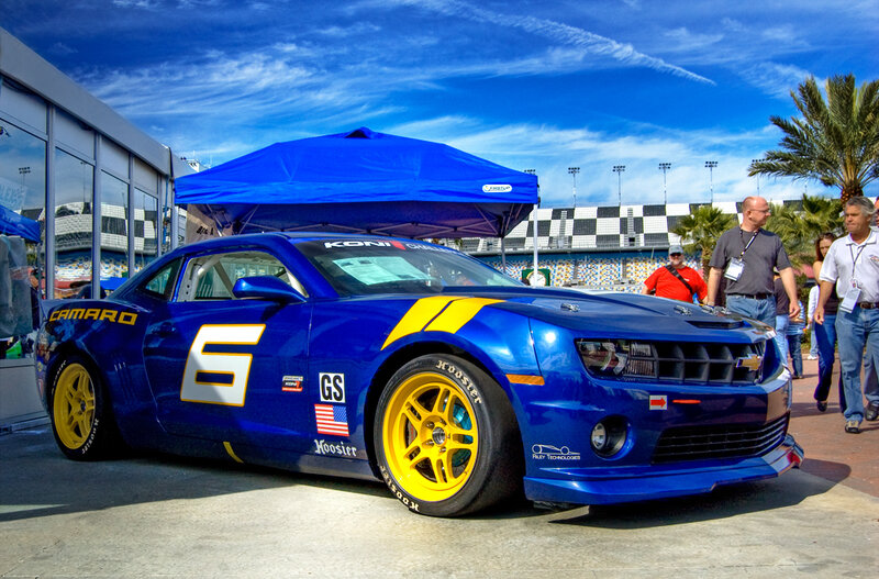Blue race car at a racetrack
