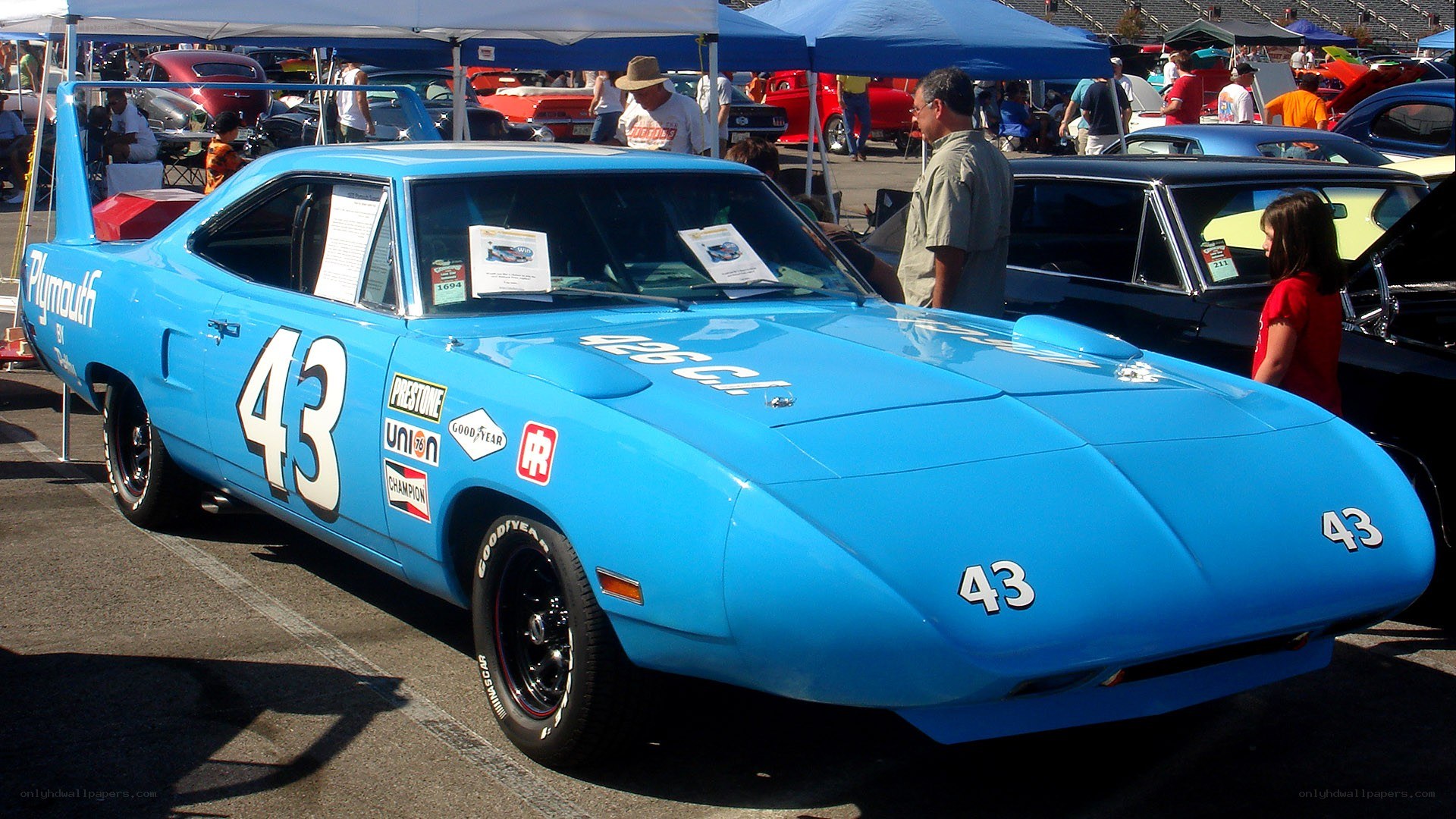 Blue race car at a show