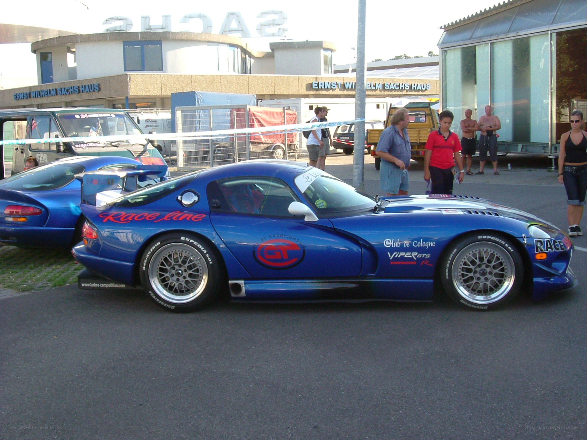 blue race car at event