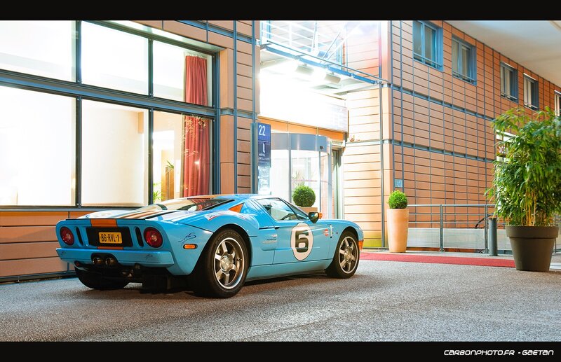 Blue race car at hotel entrance