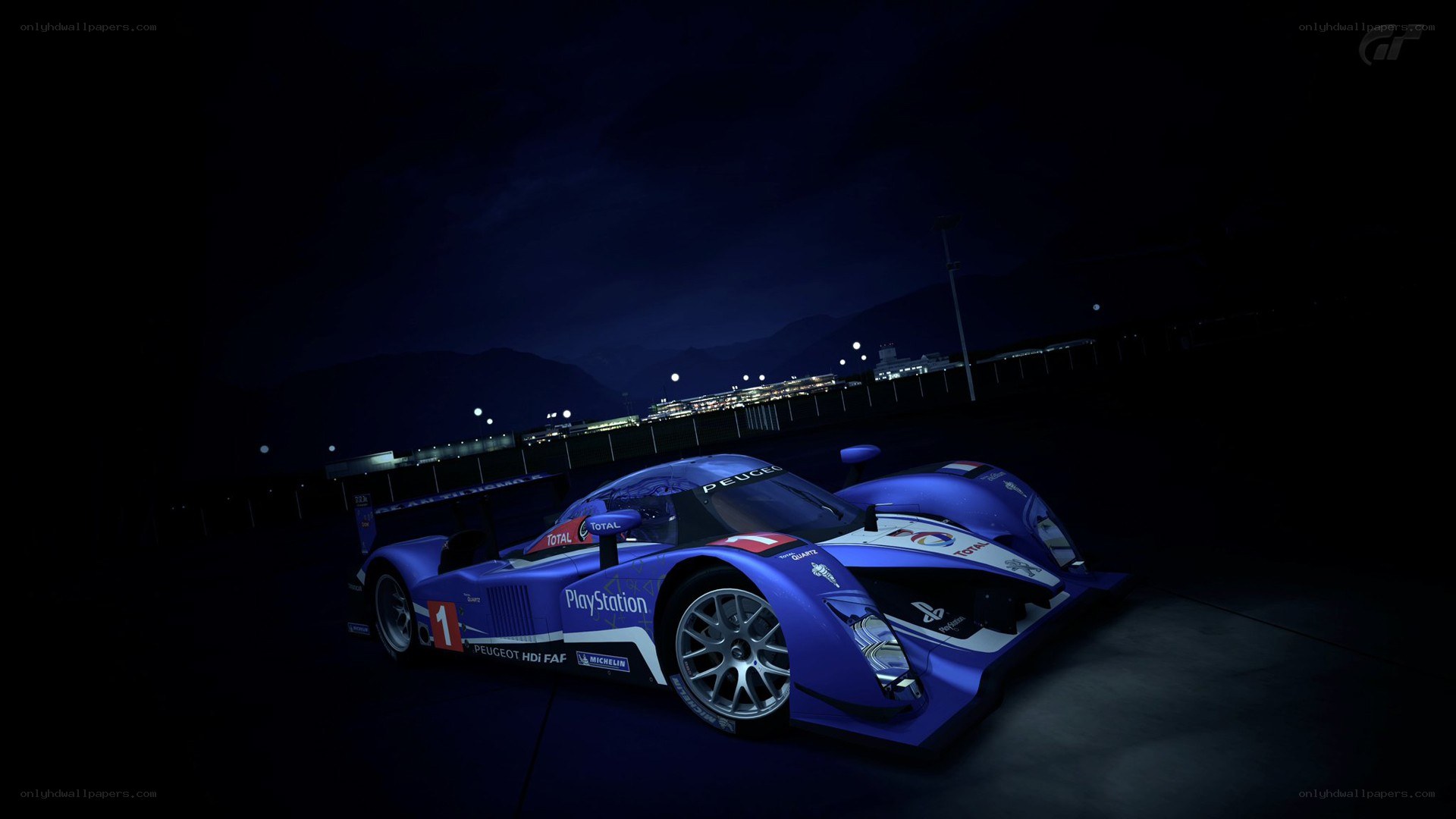 blue race car at night