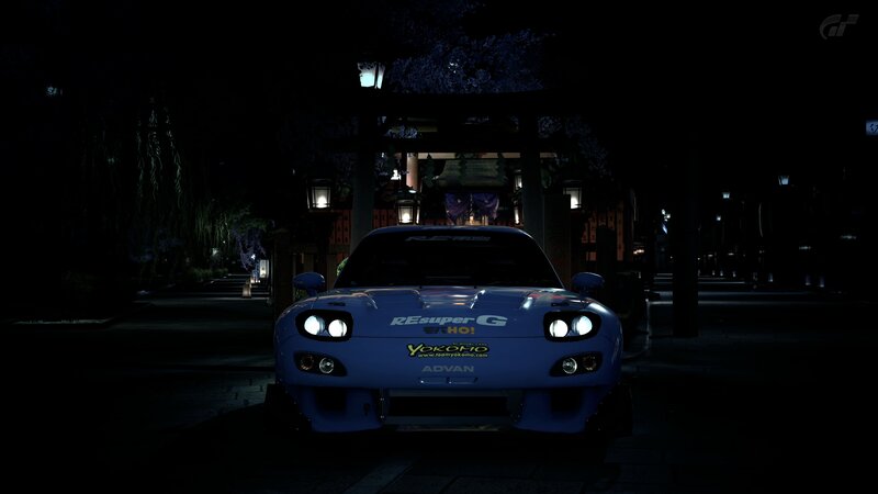 Blue race car at night