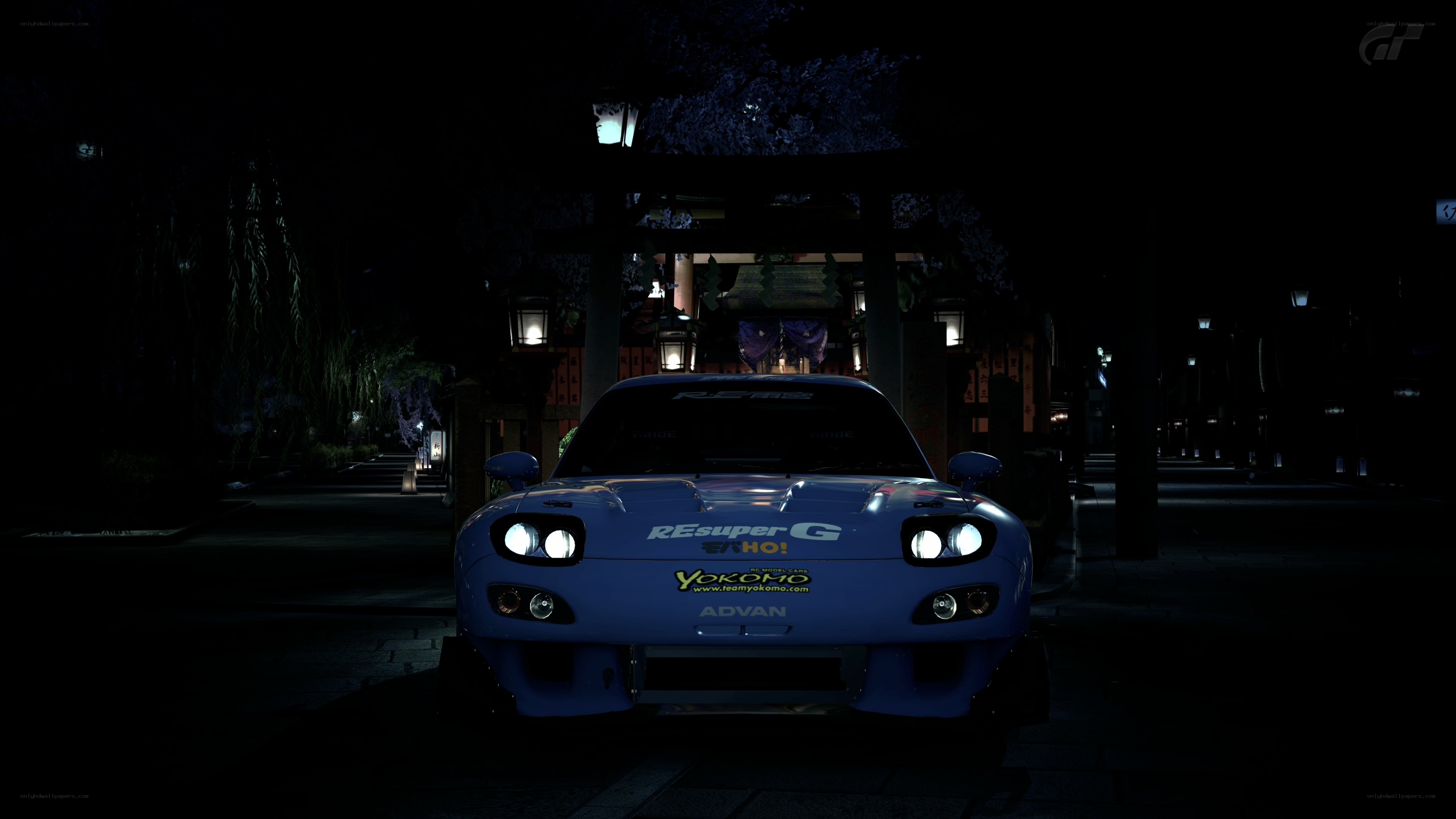 Blue race car at night