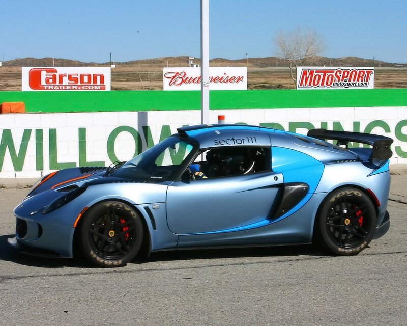 blue race car at track
