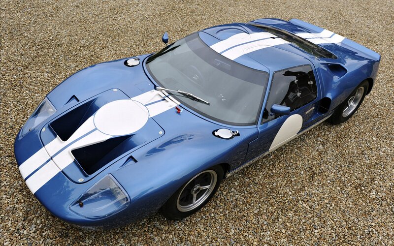 Blue Race Car — Calm, Afternoon, Photograph, Gravel