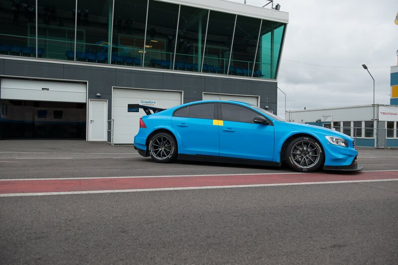 Blue Race Car — Calm, Afternoon, Photograph, Race Track, Building