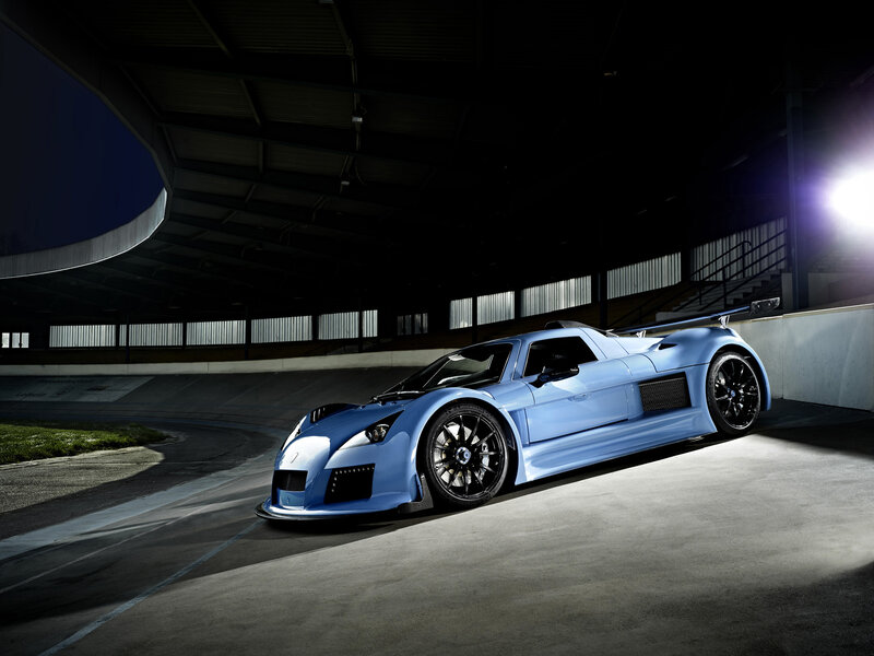 Blue Race Car — Dramatic, Night, Photograph, Race Track, Stadium Seating