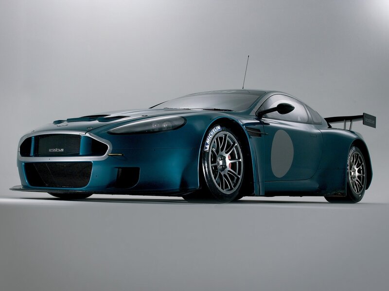 Blue Race Car — Dramatic, Photograph, Tire