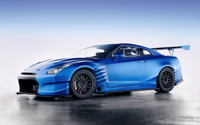 Blue Race Car — Dramatic, Photograph, Wings, Tires, Windows