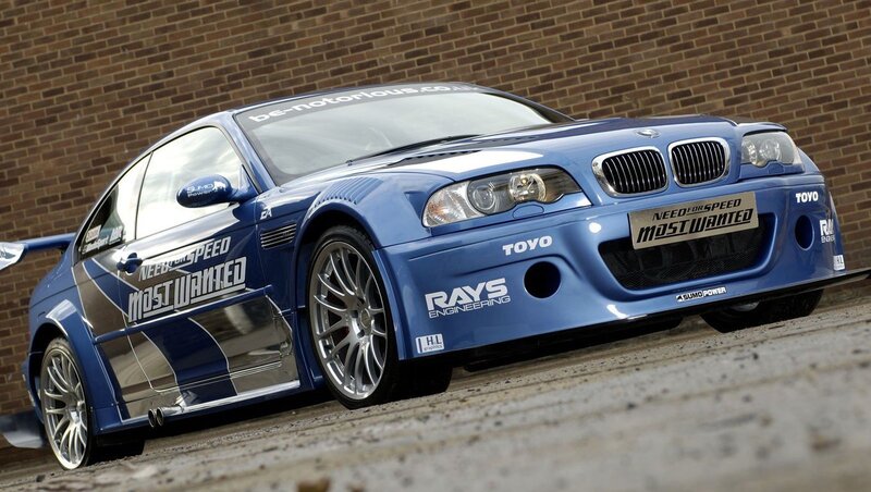 Blue Race Car — Dynamic, Photograph, Brick Wall