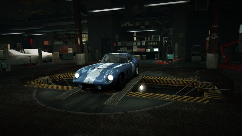 blue race car in garage