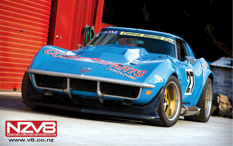blue race car in garage