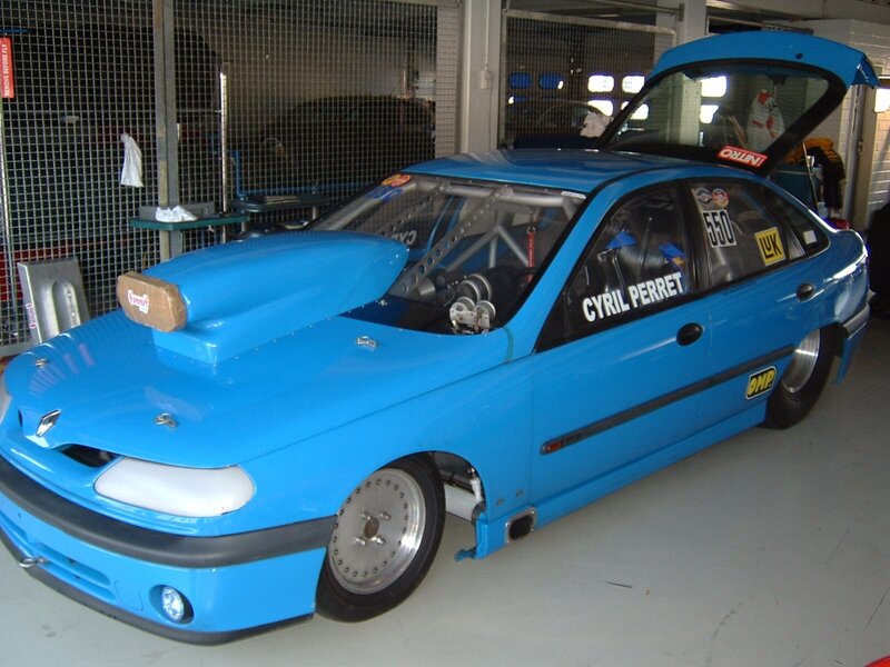 blue race car in garage