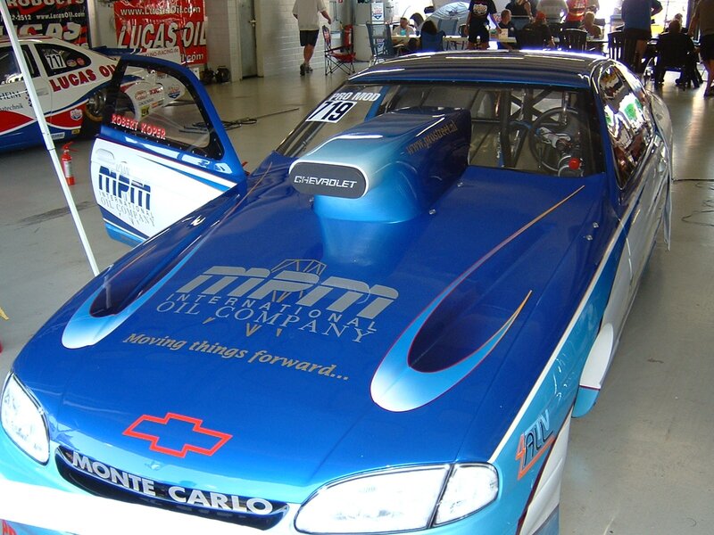 Blue race car in garage