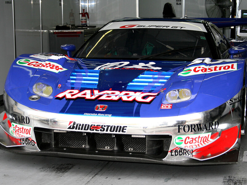 blue race car in garage