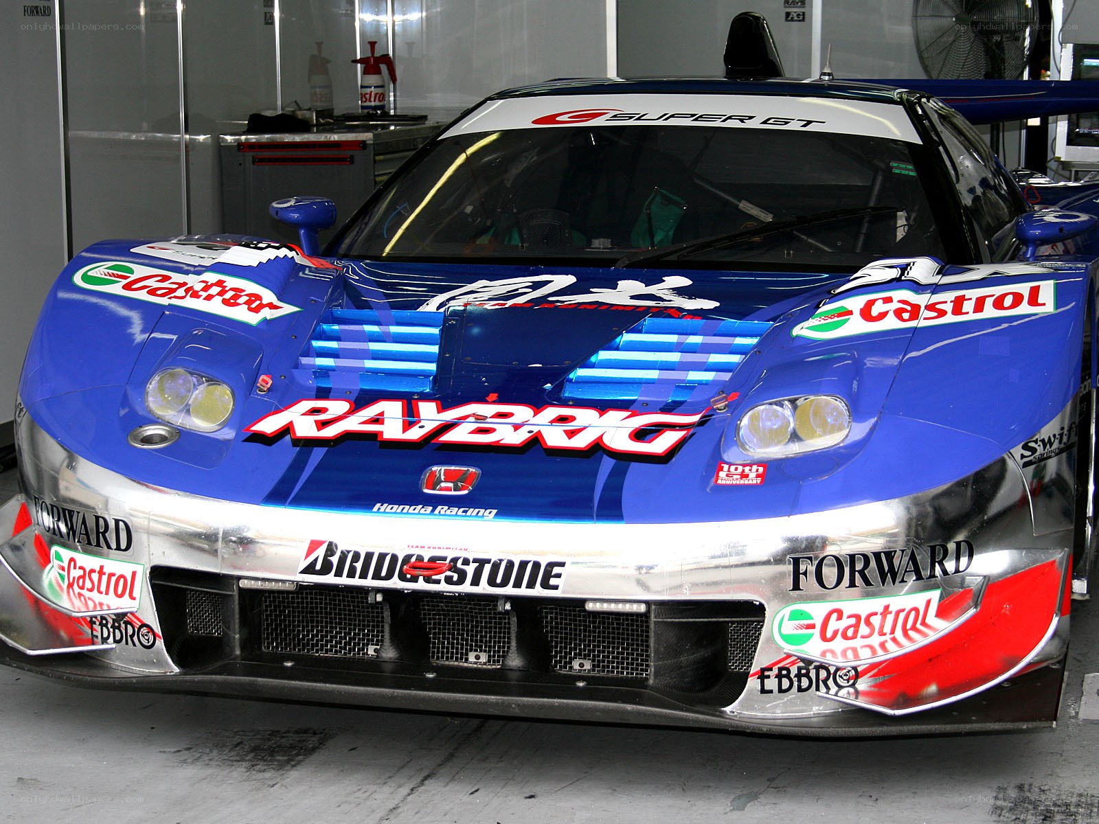 blue race car in garage