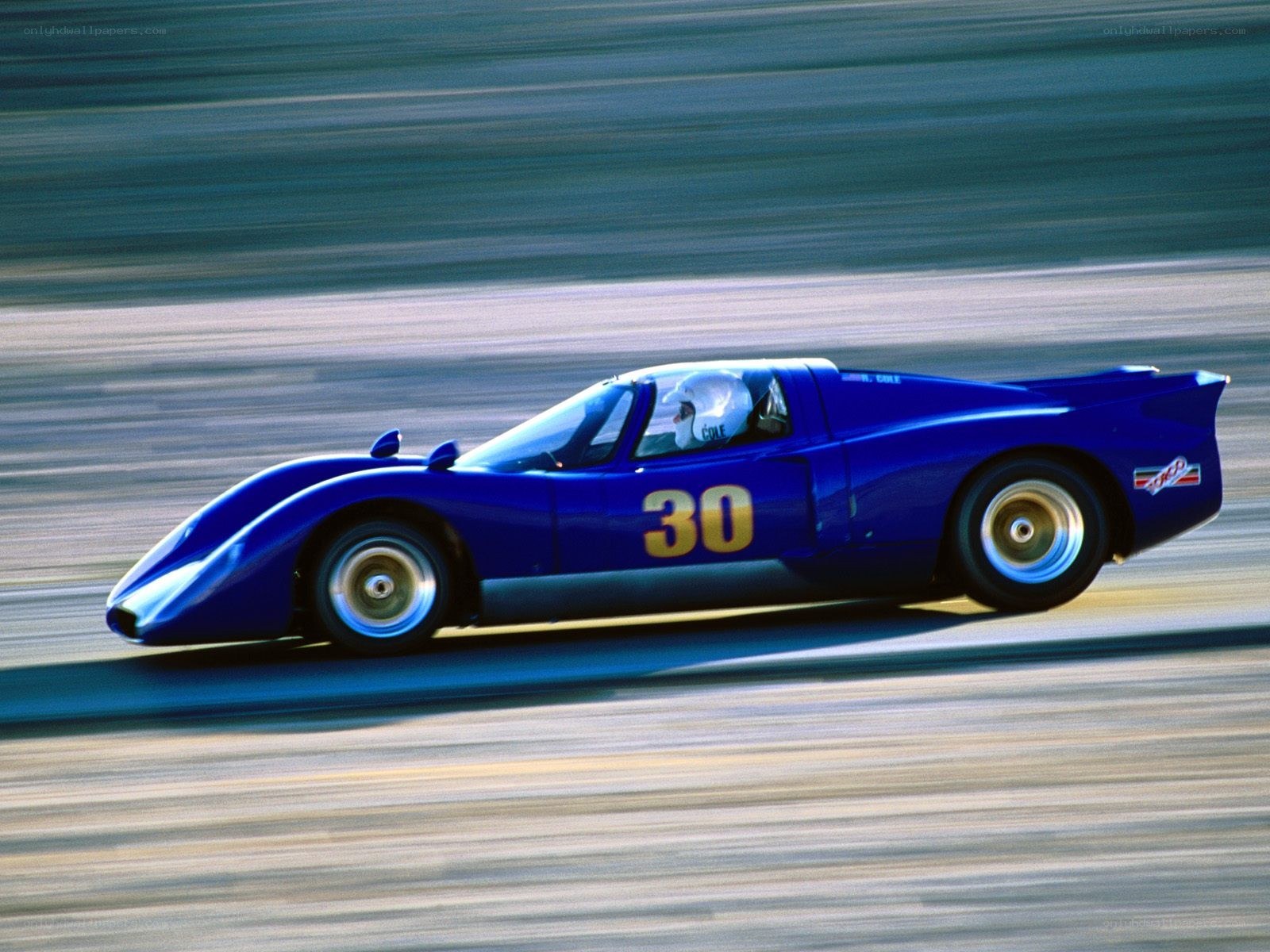 Blue race car in motion