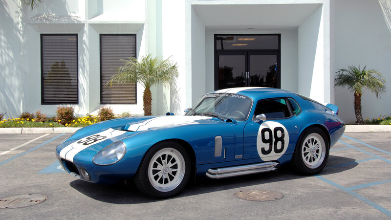 Blue race car in parking lot