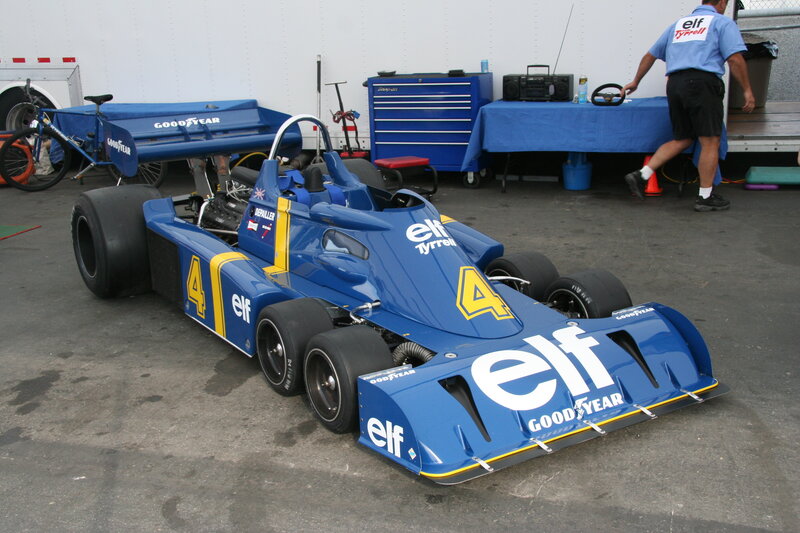 Blue race car in pit area