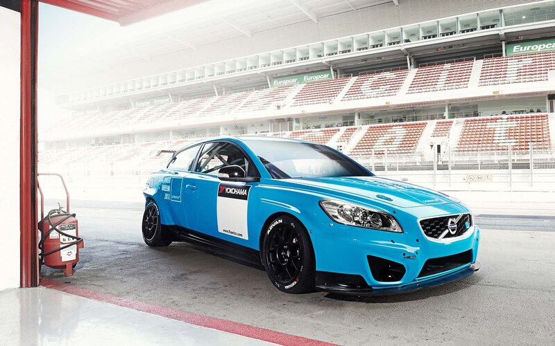 blue race car in pit lane