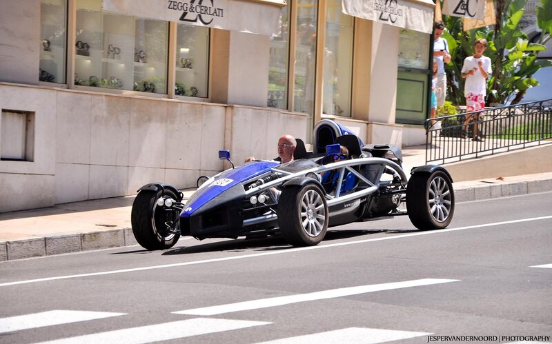 Blue race car on city street