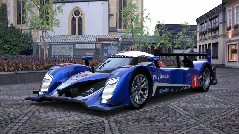 Blue race car on cobblestones