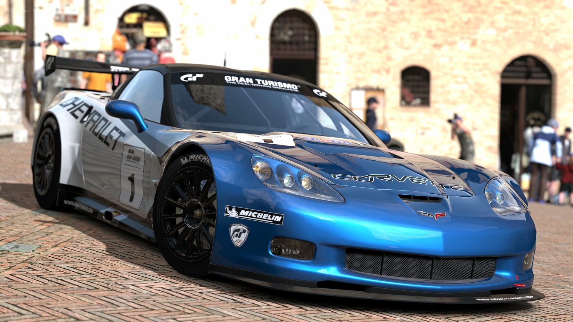 Blue race car on cobblestones