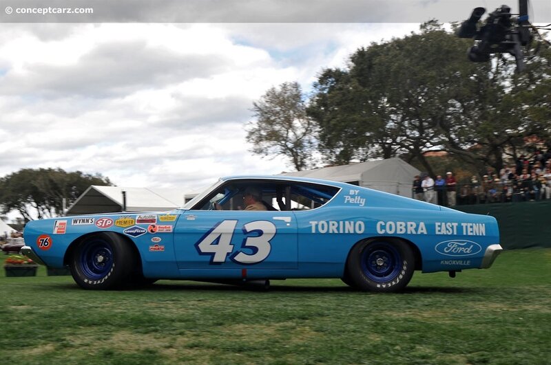 Blue race car on grass