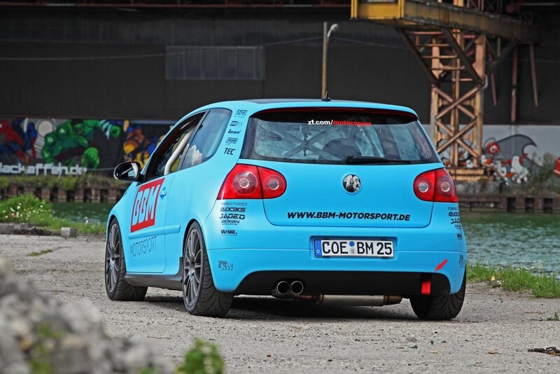 blue race car on gravel